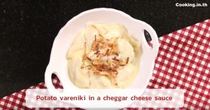 Potato vareniki in a cheggar cheese sauce